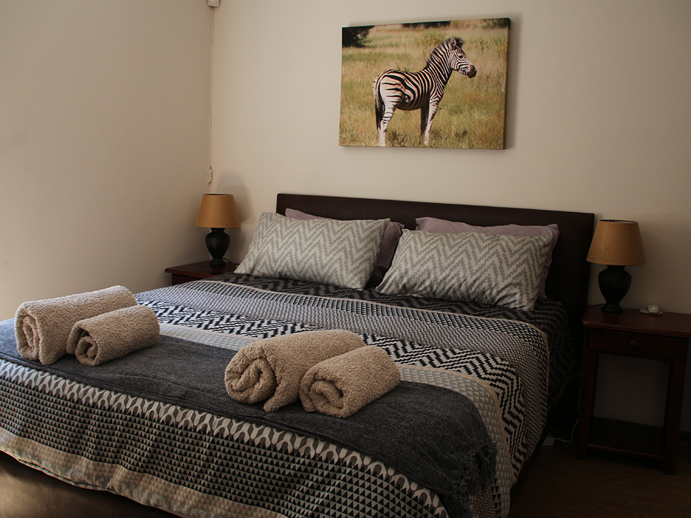 Südafrika: Ferienhaus Perle unter der Sonne, Schlafzimmer mit Queensize-Bett